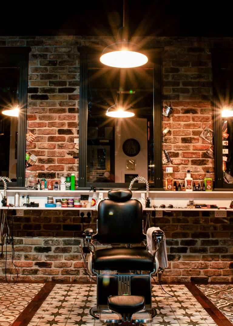Barbershop chairs and mirrors in warm light