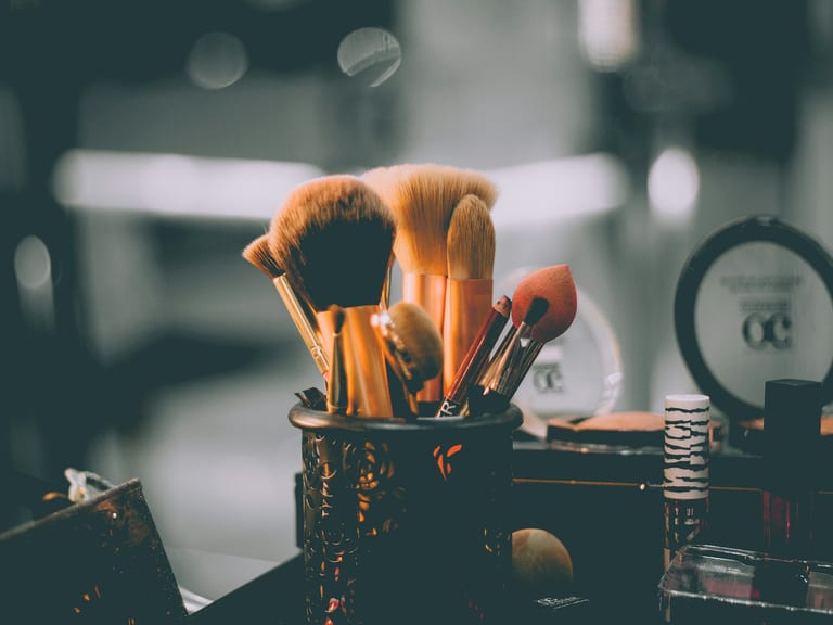 Brushes and grooming products arranged on a counter
