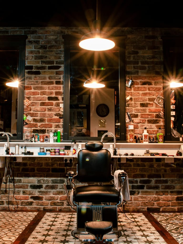 The shop floor, chairs and mirrors under warm lights
